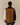 Back view of the Franklin Relaxed Corduroy Shirt Brown, featuring a dark brown collar, tan back panel, cream left sleeve, and dark brown right sleeve.