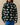 A person wears a forest green Warm & Wonderful Sheep Sherpa Jacket Green zip-up fleece featuring a repeating pattern of white sheep.