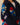 Person wearing the Paddington Sherpa Jacket Navy by Rowing Blazers x Paddington™, a navy sherpa fleece with colorful prints, including Paddington’s red hat and a Rowing Blazers patch on the sleeve.