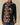Cotton Sheep Scarf Brown featuring a pattern of small white sheep with one black sheep on a brown knit background.
