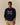 A navy blue Rowing Blazers x Paddington™ Paddington Cotton Text Sweater featuring the embroidered white text Please look after this BEAR. THANK YOU.